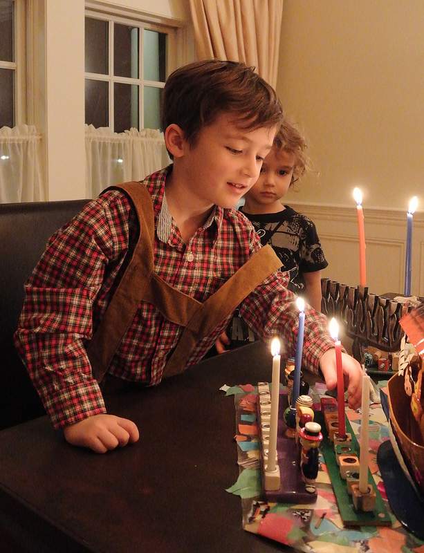 Lighting Hanukkah Menorah in Lederhosen