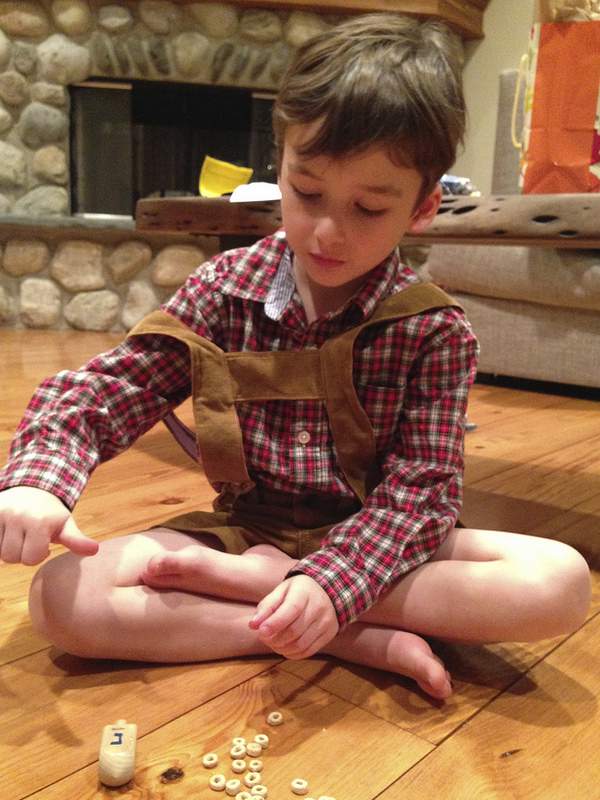 Playing dreidel in lederhosen