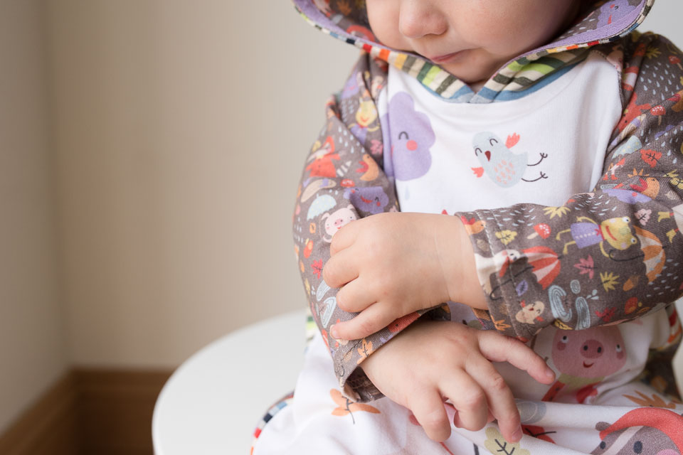 Rainy days rainbow dress. A mashup of the Safari Raglan dress with the Rowan Tee hood, both patterns by Titchy Threads.