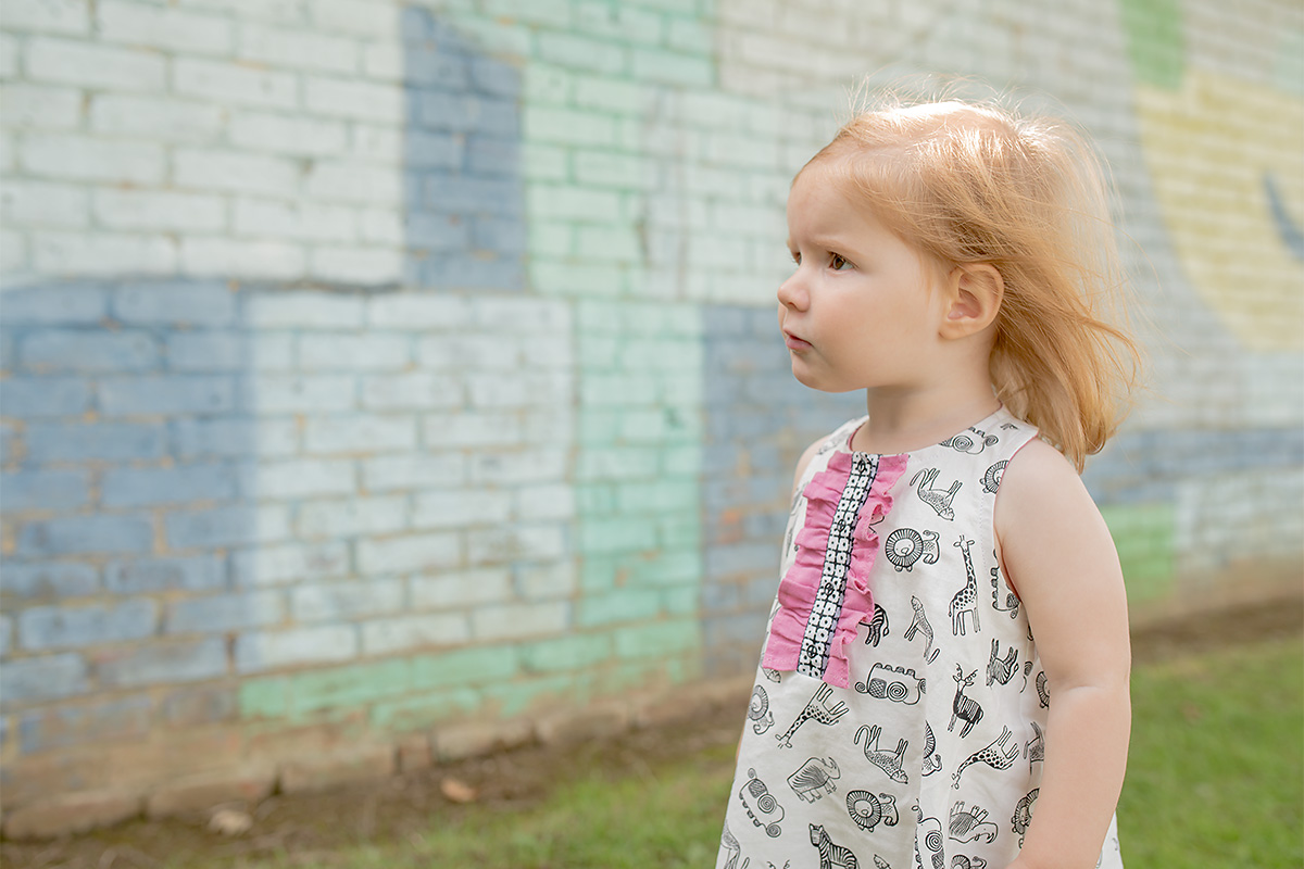 Wee wanders Rushbrook dress with pink ruffle placket